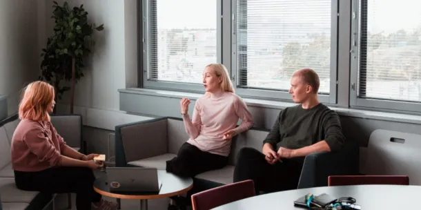 Students speaking in a casual setting.