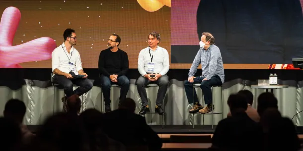 A snapshot from AI Con 2025 with keynore speaker Jeremey Howard with other presenters on stage.