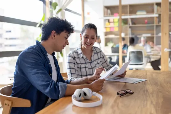 Man and woman sitting at a table studying