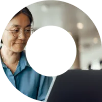 Woman typing on laptop within a viewfinder shape