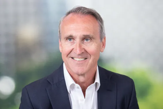 Business man, portrait photos, looking off camera to left with white open shirt and dark business suit
