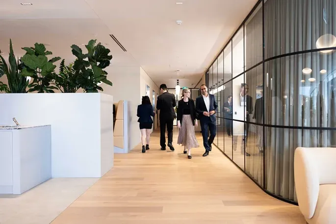 A group of actuaries walking down the hallway