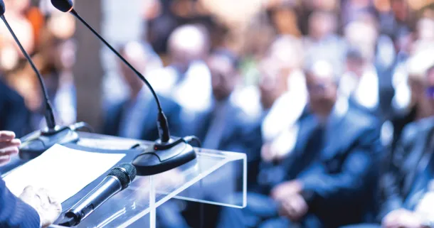 Speaker at business conference.