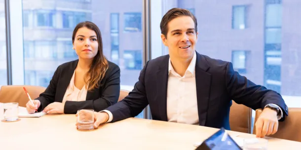 Two actuaries in a conference room
