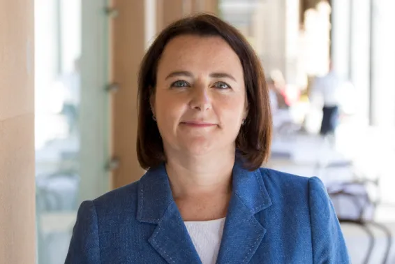 Portrait photo Elayne Grace in blue jacket