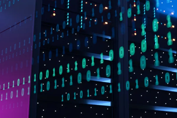 Night time image of city building with code superimposed over the top.