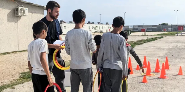 Children playing games at a refugee camp