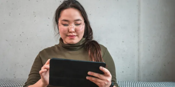 Lady holding an Ipad