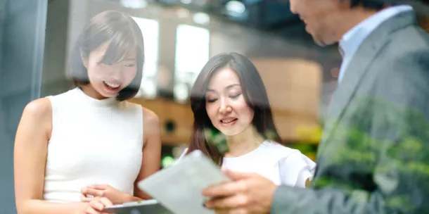 People discussing the content on a device