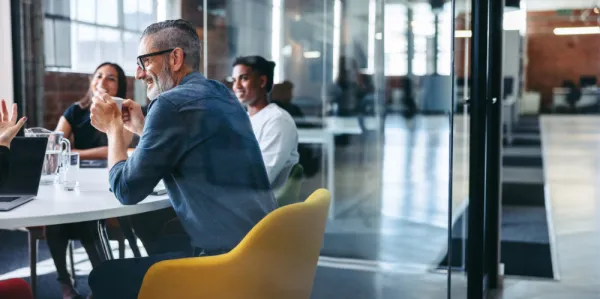 A collective committee working together in an office. 