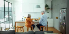 Senior couple having breakfast at home together