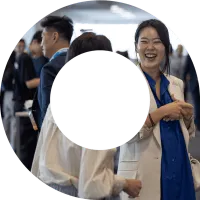 Three actuaries networking at an event. Photo is within a view finder