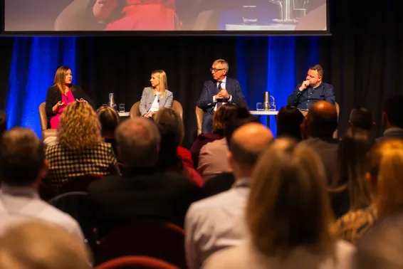 Four speakers onstage at the 2023 Injury and Disability Schemes Seminar.