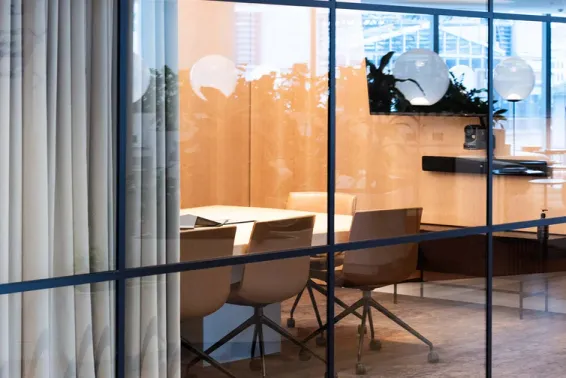 boardroom with chairs and lights in it