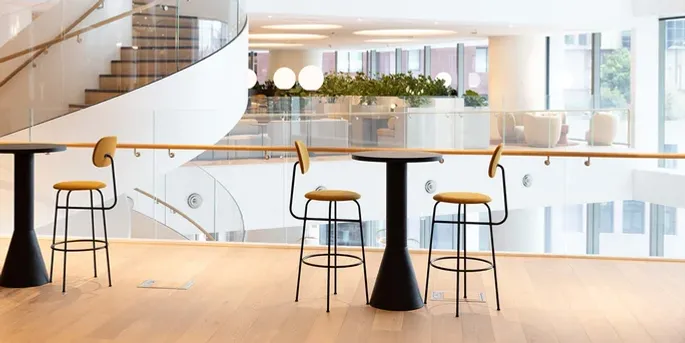 Chairs and a spiral staircase in a professional work building