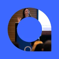 Person speaking at lectern.