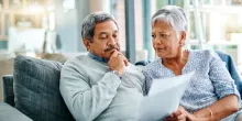 A mature couple reviewing their finances.