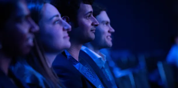 A photo of actuaries listening to a conference session