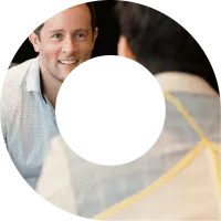 Two actuaries in discussion within viewfinder shape