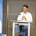 Man standing at a lectern at an Actuaries Institute event