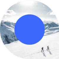 Two people climbing a snowy mountain