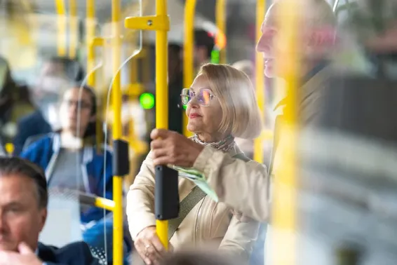 Lady and man riding the bus