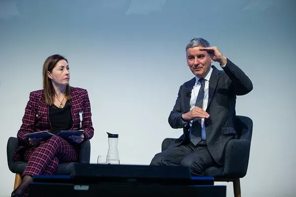 Jonathan Larsen on stage with chair of the session, Annette King.