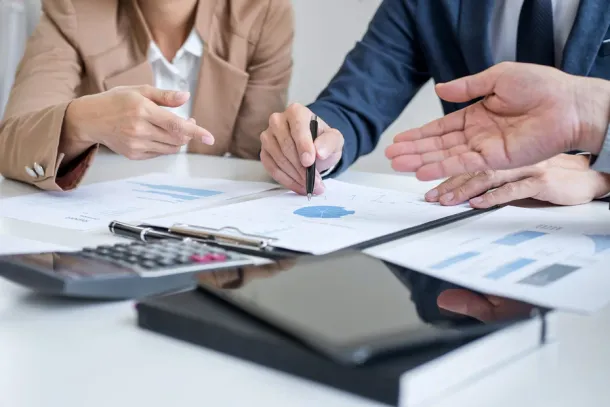 Group of partner working conversation, Business team meeting present with investor colleagues discussing plan financial graph data and analyzing strategy to growth up to profit into company.