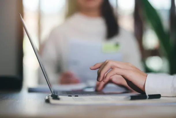 business people use laptops working through an online network,to analyze and improve corporate strategies Manage financial and marketing documents company growth information data management